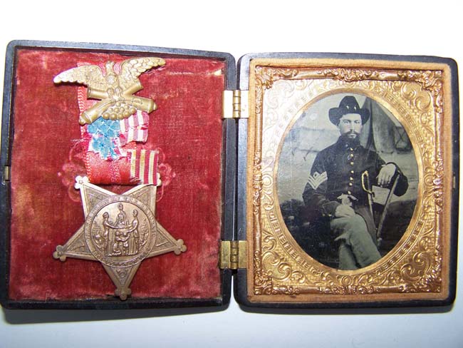A Civil War Ambrotype Photo circa 1863 of a Union Sergeant sitting in front of a field tent along with his G A R medal.